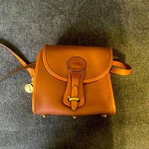 Dooney and Bourke All-weather leather Structured Crossbody bag in warm brown!